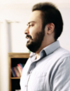A picture of Santan Singh in a white collar shirt